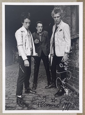 Lot 45 - THE CLASH - PAUL SIMONON AND JOE STRUMMER SIGNED PHOTOGRAPH.