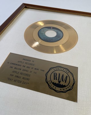 Lot 427 - THE BEATLES INTEREST - ORIGINAL RIAA GOLD RECORD AWARD PRESENTED TO APPLE FOR 'DAY AFTER DAY'.