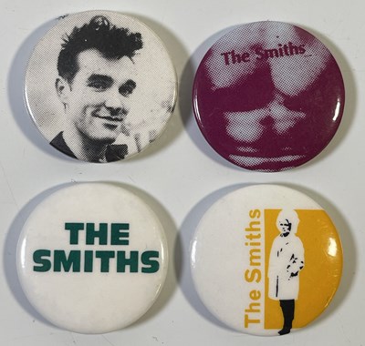 Lot 152 - THE SMITHS - VHS TAPES AND BADGES.