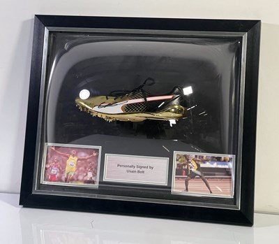 Lot 329 - USAIN BOLT - FRAMED DISPLAY WITH SIGNED BOOT.