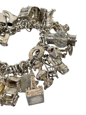 Lot 14 - SILVER CHARMS.